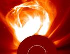 SOHO image of a Coronal Mass Ejection extending millions of kilometers from the solar surface.